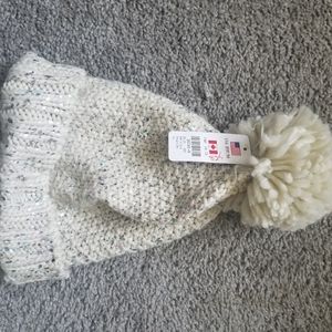 Knitted beanie with a puff ball
